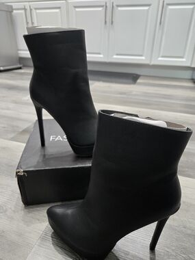 Fashion Nova Out And About Platform Booties in black featuring a stiletto heel